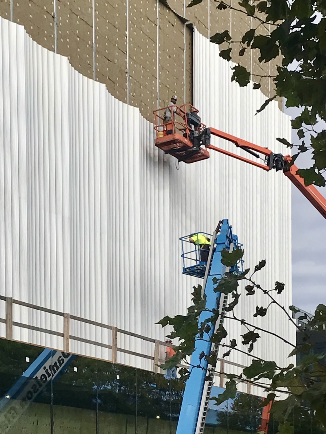 Installation of the extruded aluminum fluted panels